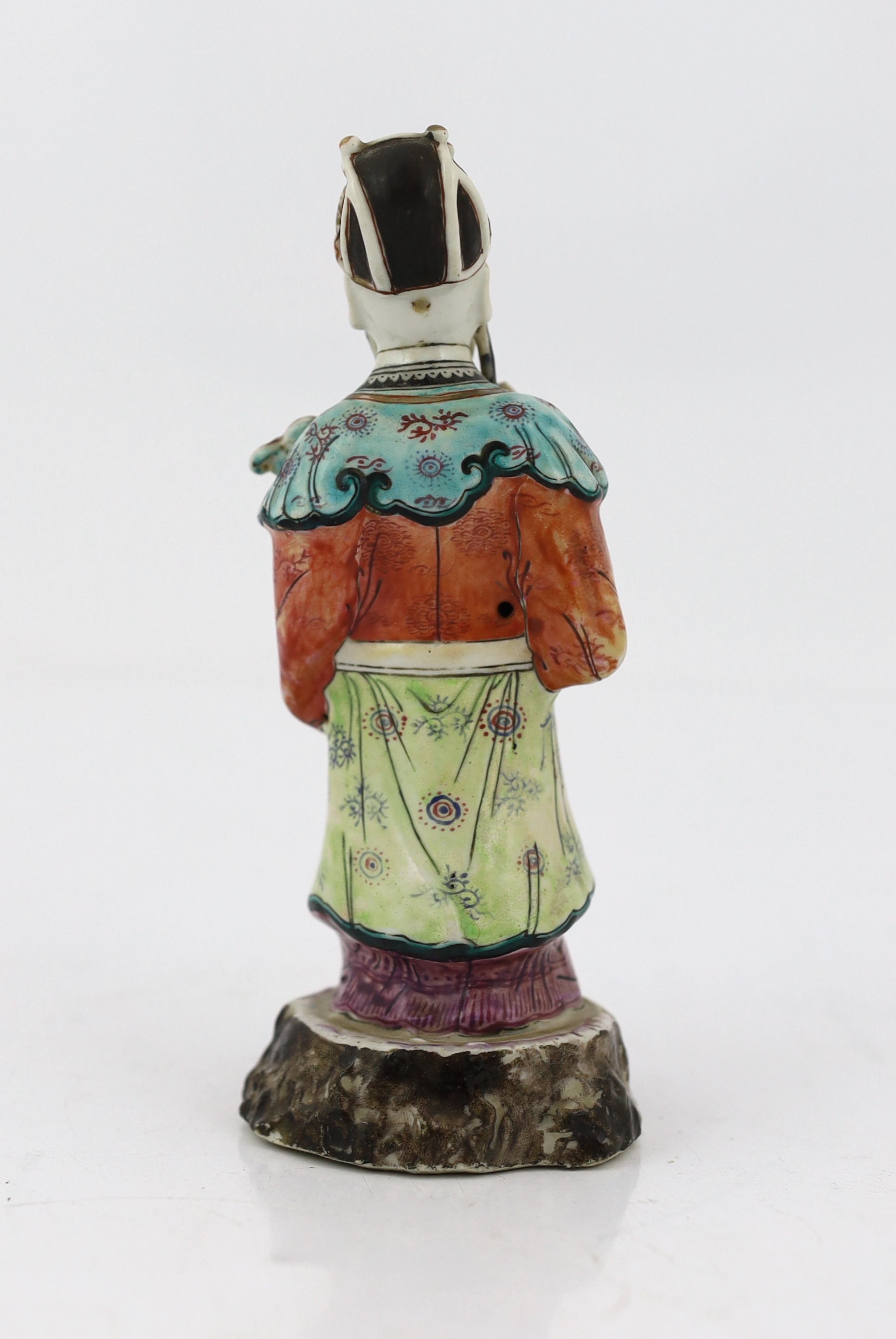 A Chinese enamelled porcelain figure of a court official, Jiaqing period (1796-1820), loss to right index finger